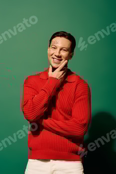 A young man with tattoos smiles confidently against a vibrant green backdrop during a photoshoot 2 E11LEA6.jpg?w=350&h=350&cf fit=scale down&mark=https%3A%2F%2Fassets.market storefront.envato static.com%2Fwatermarks%2Fphoto 260724