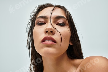 This striking woman gazes confidently at the viewer, exuding beauty in a serene setting 2 E11GEJ2.jpg?w=350&h=350&cf fit=scale down&mark=https%3A%2F%2Fassets.market storefront.envato static.com%2Fwatermarks%2Fphoto 260724
