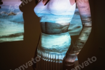 Young adult woman 20 years old with projected image of ocean or see in neon colors 2 E1018ZTD.jpg?w=350&h=350&cf fit=scale down&mark=https%3A%2F%2Fassets.market storefront.envato static.com%2Fwatermarks%2Fphoto 260724