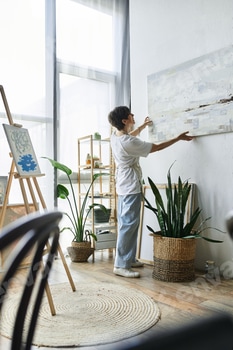 Mature woman arranging her artwork in a bright, inspiring art studio setting 2 E11DAPV.jpg?w=350&h=350&cf fit=scale down&mark=https%3A%2F%2Fassets.market storefront.envato static.com%2Fwatermarks%2Fphoto 260724