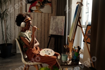 Young Artist Enjoying Creating Artwork in Studio 2 E117X7JG.jpg?w=350&h=350&cf fit=scale down&mark=https%3A%2F%2Fassets.market storefront.envato static.com%2Fwatermarks%2Fphoto 260724