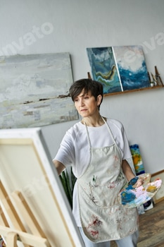 Mature woman creating art in her vibrant studio during a sunny afternoon 2 E11DATL.jpg?w=350&h=350&cf fit=scale down&mark=https%3A%2F%2Fassets.market storefront.envato static.com%2Fwatermarks%2Fphoto 260724