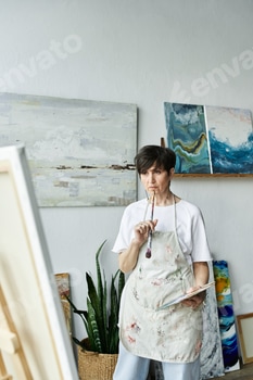 Mature woman immersed in creativity at her art studio during a moment of inspiration 2 E11DATR.jpg?w=350&h=350&cf fit=scale down&mark=https%3A%2F%2Fassets.market storefront.envato static.com%2Fwatermarks%2Fphoto 260724