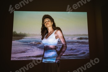 Young adult woman 20 years old with projected image of ocean or see in neon colors 2 E1018ZJD.jpg?w=350&h=350&cf fit=scale down&mark=https%3A%2F%2Fassets.market storefront.envato static.com%2Fwatermarks%2Fphoto 260724