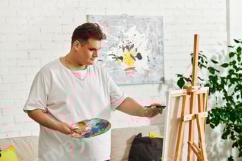 A queer artist passionately creating a unique masterpiece in a bright studio space 2 E11JW7M.jpg?w=350&h=350&cf fit=scale down&mark=https%3A%2F%2Fassets.market storefront.envato static.com%2Fwatermarks%2Fphoto 260724