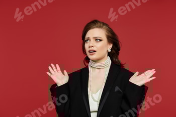 Young woman in elegant attire expresses emotions against a vibrant red backdrop 2 E11OA8N.jpg?w=350&h=350&cf fit=scale down&mark=https%3A%2F%2Fassets.market storefront.envato static.com%2Fwatermarks%2Fphoto 260724