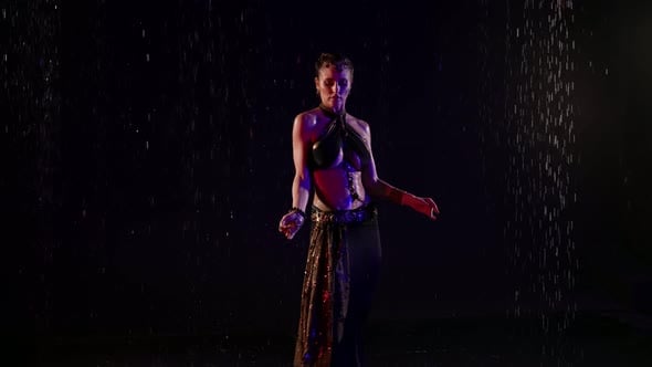 Sexy Lady is Performing Oriental Dance Under Rain Woman is Wearing Traditional Arabic or Indian Suit, Stock Footage Sexy Lady is Performing Oriental Dance Under Rain Woman is Wearing Traditional Arabic or Indian Suit, Stock Footage